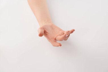 Partial view of female well-cared open hand on white background  clipart