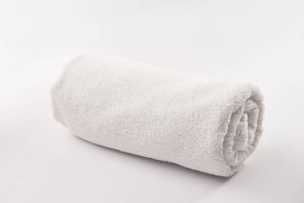 Terry soft rolled towel on white background