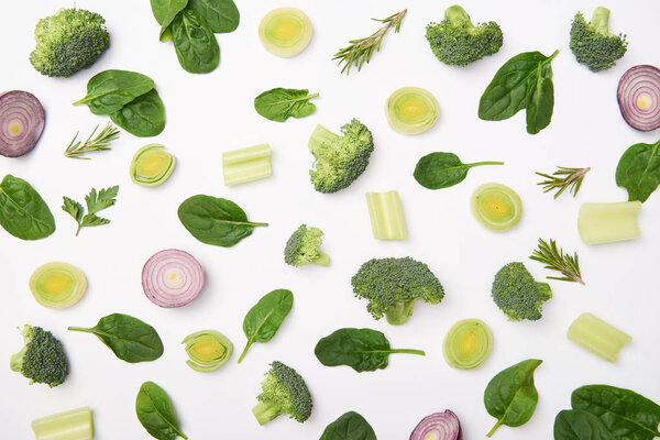 Flat lay with natural cut vegetables on white background