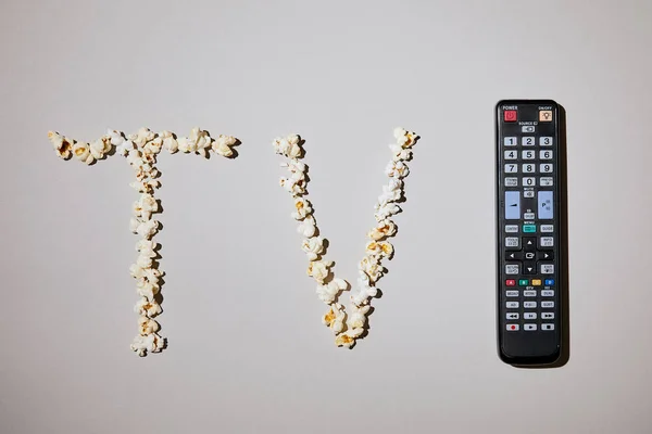 Top View Tasty Popcorn Lettering Remote Control White Background — Stock Photo, Image