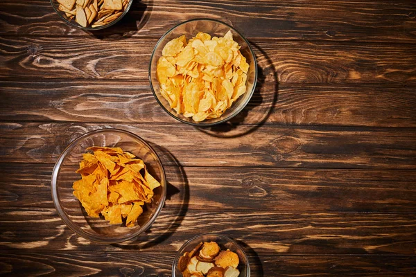 Top view of party snacks in bows on wooden table — Stock Image Top View Party Snacks Bows Wooden Table Royalty Free Stock Images