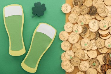 top view of golden coins with dollar signs, shamrock and paper beer glasses, st patrick day concept clipart