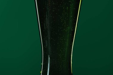 close up of beer glass isolated on green, st patrick day concept clipart