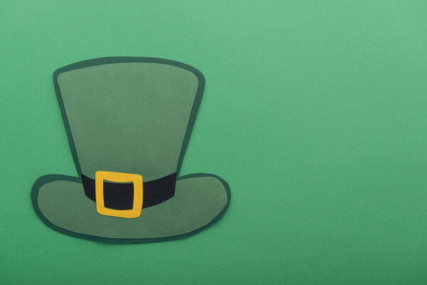 top view of paper hat isolated on green with copy space, st patrick day concept