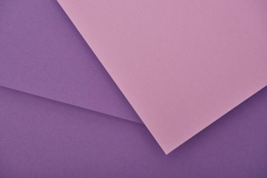 top view of lilac and violet laid out paper sheets with copy space clipart