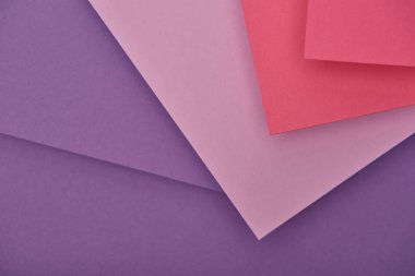 top view of purple and pink paper sheets with copy space clipart