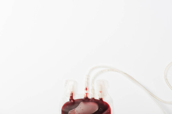 Top view of drip with blood isolated on white, blood donation concept
