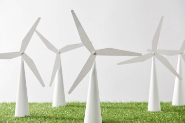 windmill models on grass and white background clipart