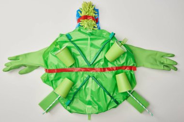 top view of turtle made from rubber gloves, disposable plastic tableware, bag, sponges isolated on white