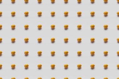 top view of yellow bright lemons on grey background, seamless pattern clipart