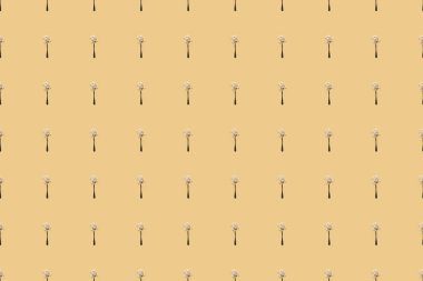 scattered flour in spoons on yellow background, seamless pattern clipart