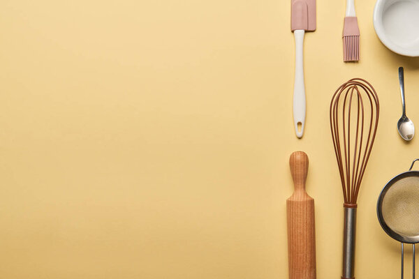 flat lay with cooking utensils on yellow background with copy space
