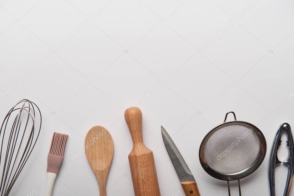 top view of cooking utensils on grey background 
