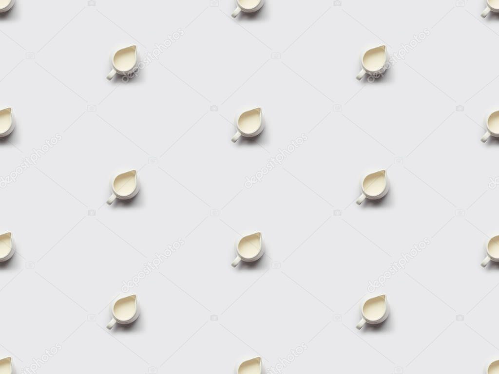 collage of milk in jars on grey background, seamless pattern
