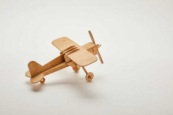 toy plane on grey background with copy space