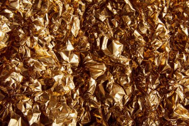 top view of crumpled golden foil with twinkles clipart