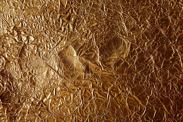 top view of rumpled sheet golden foil