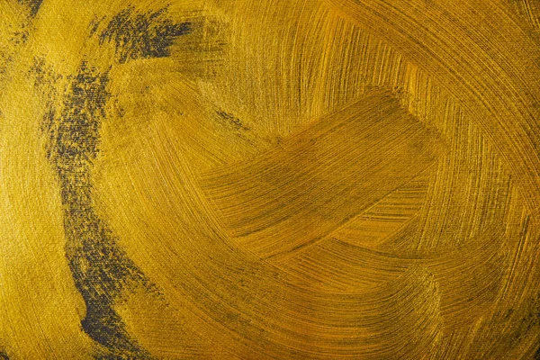 different golden brushstrokes on dark textured background