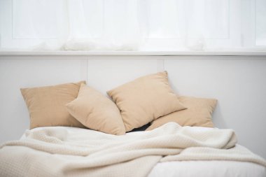 empty bed with brown pillows and white blanket clipart