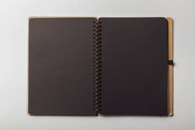top view of black opened notebook on white background clipart