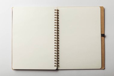 top view of opened notebook with blank pages on white background clipart