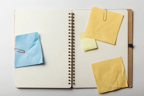 Top View Opened Notebook Blue Yellow Sticky Notes Paper Clips — Stock Photo, Image