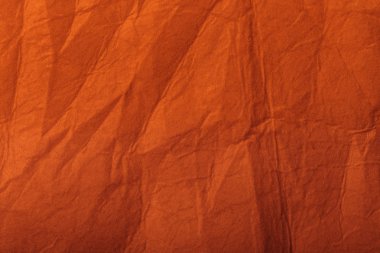 orange textured crumpled page with copy space clipart