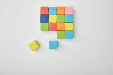 top view of multicolored blocks on grey background clipart