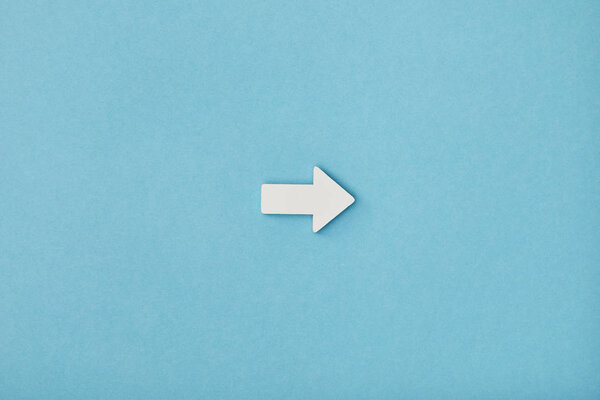 top view of white horizontal pointer on blue background