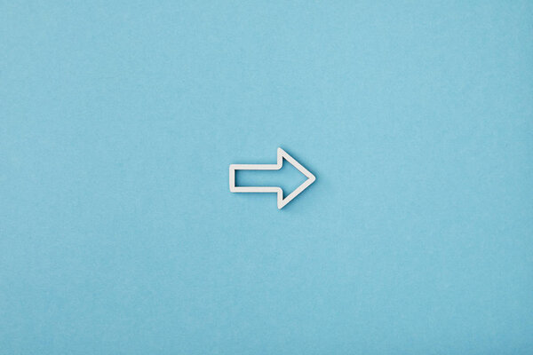 top view of white horizontal frame pointer on blue background