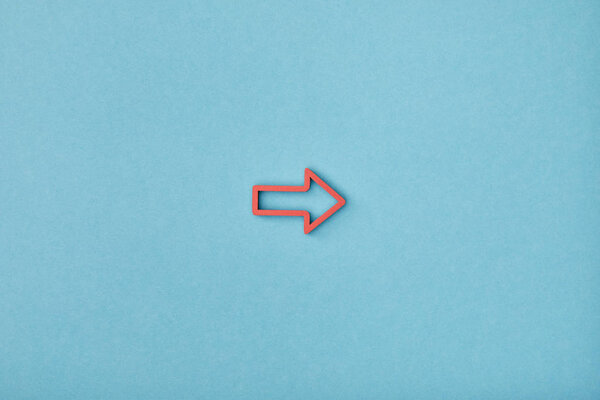 top view of red horizontal frame pointer on blue background