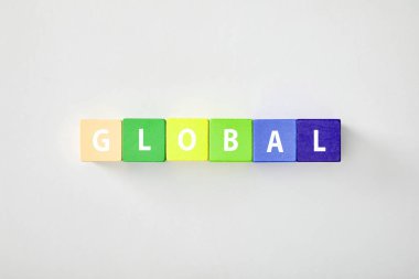 top view of global made of multicolored cubes on grey background clipart