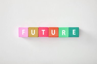 top view of future made of multicolored cubes on grey background
