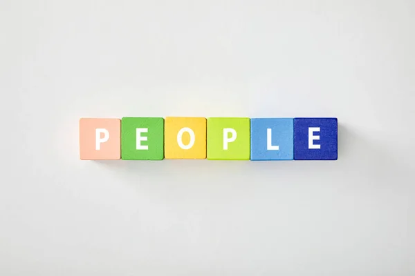 Top View People Lettering Made Multicolored Cubes White Background — Stock Photo, Image