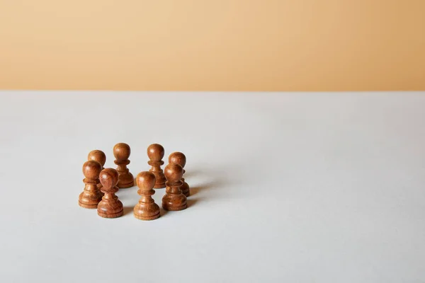 Wooden Pawn Pieces White Table Beige Background — Stock Photo, Image