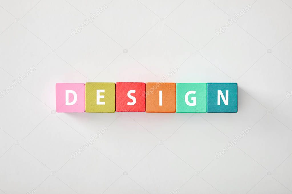 top view of design made of multicolored cubes on grey background