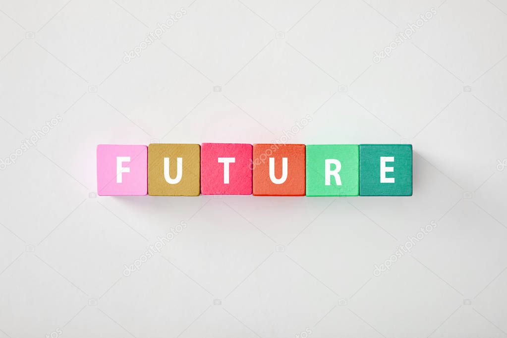 top view of future made of multicolored cubes on grey background