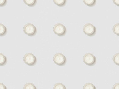 containers cosmetic cream on grey background, seamless background pattern