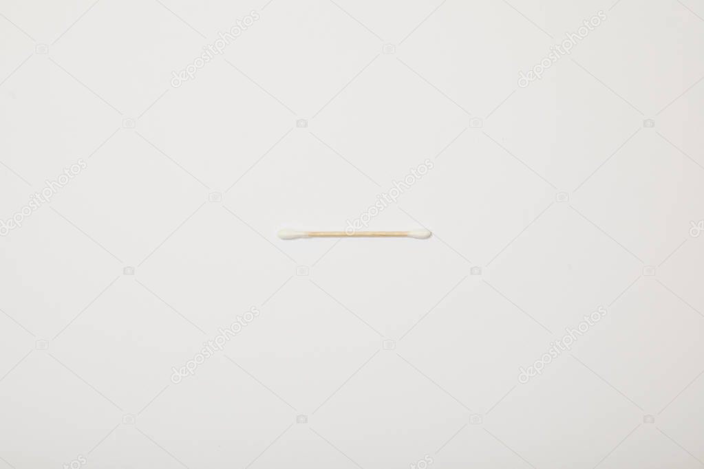 top view of cotton ear stick on white background