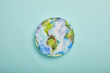 top view of planet picture on turquoise background, earth day concept clipart