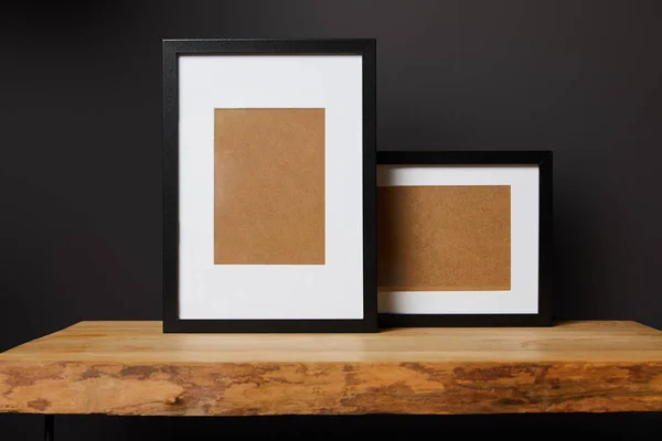 Black Blank Frames Wooden Table Home — Stock Photo, Image