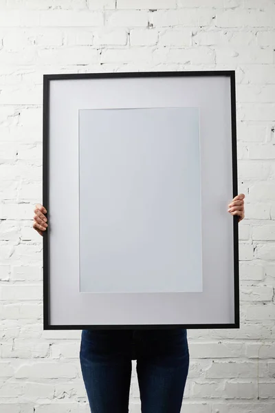 Woman Covering Face While Holding Blank Black Frame Hands — Stock Photo, Image