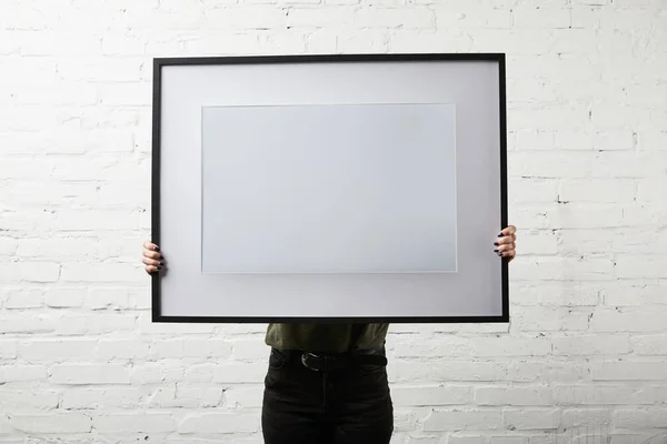 Woman Covering Face While Standing Holding Blank Frame Hands — Stock Photo, Image