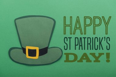 paper hat near happy st patricks day lettering on green background clipart
