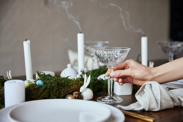 Cropped View Woman Putting Crystal Glass Plates Candles Moss Wooden — Stock Photo, Image