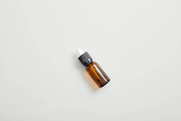 Top View Brown Bottle Essential Oil Grey Background — Stock Photo, Image