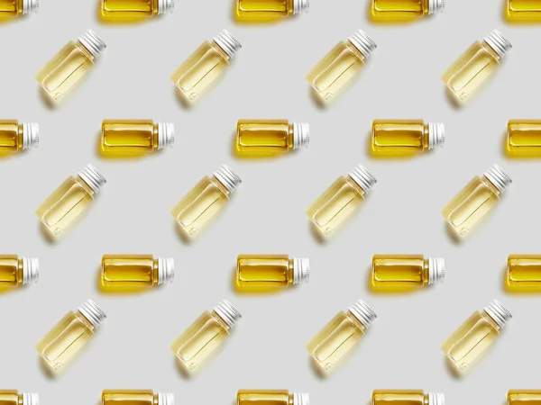 Плоская Поверхность Сером Фоне Стеклянными Бутылками Эфирного Масла — стоковое фото
