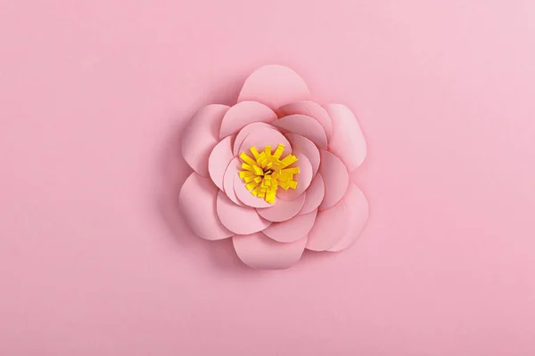 Kağıt Çiçek Pembe Bir Arka Plan Üzerinde Yukarıdan — Stok fotoğraf