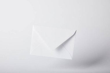 blank and white envelope on grey background with copy space  clipart