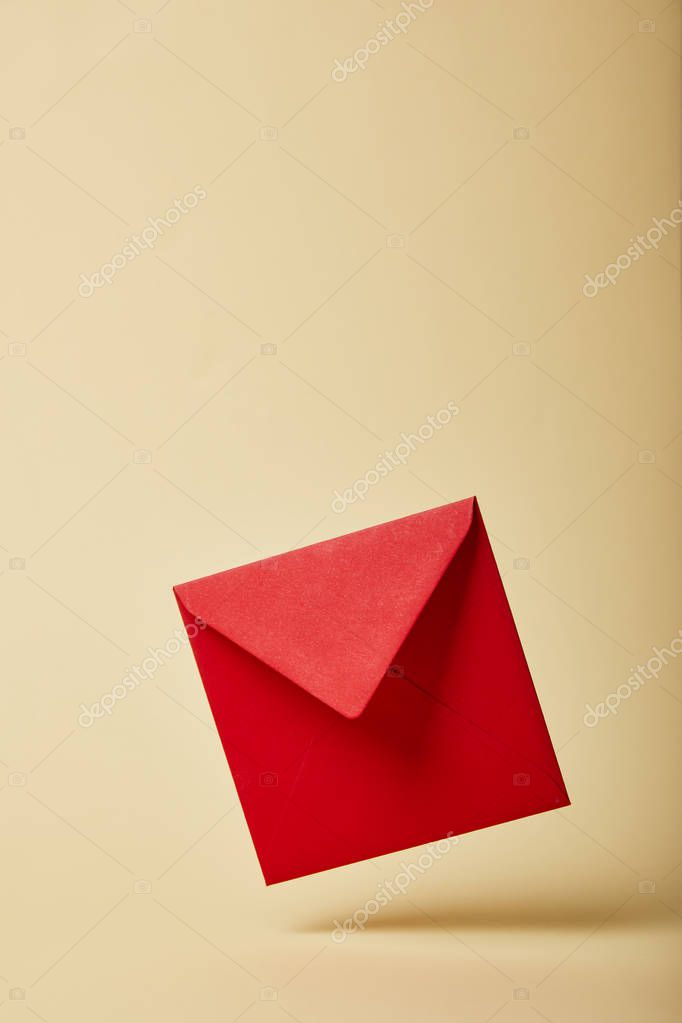 Red and bright envelope on colorful and yellow background with copy space